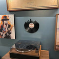 Vinyl record Dallas skyline wall art displayed in modern living room gallery wall décor above record player.